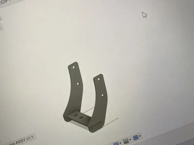 Mounting bracket modeled in CAD on a computer screen