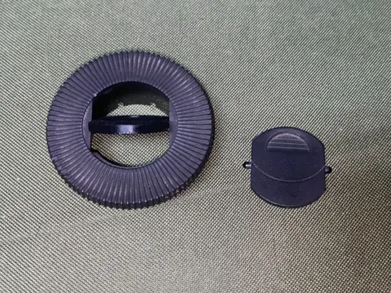 Defroster vent insert next to its housing ring